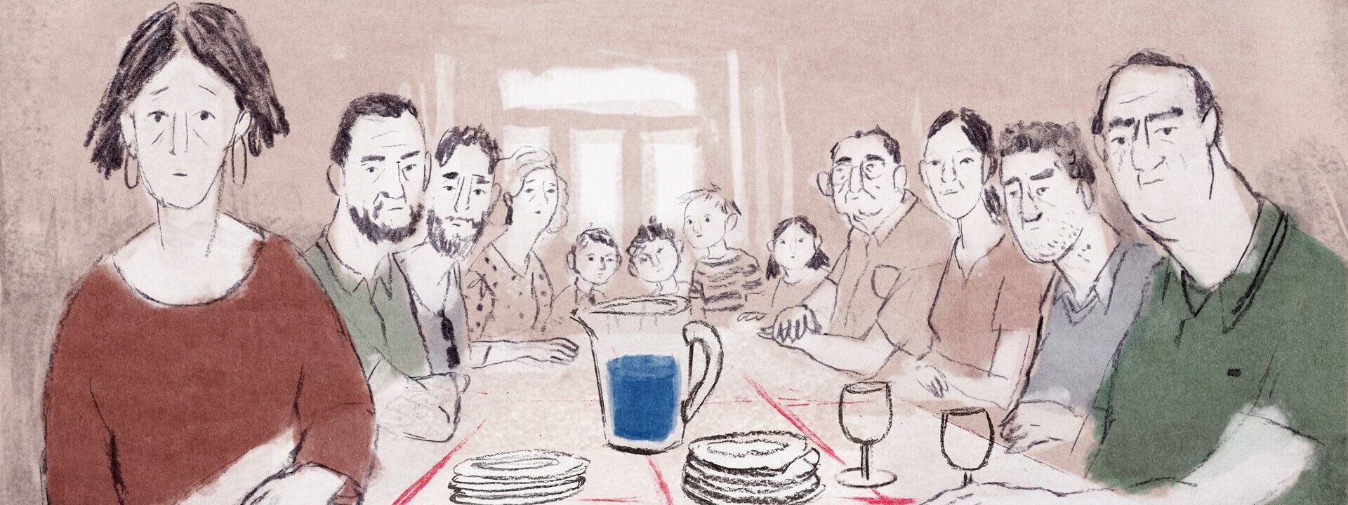 Una mesa repleta de gente dispuesta para comer.