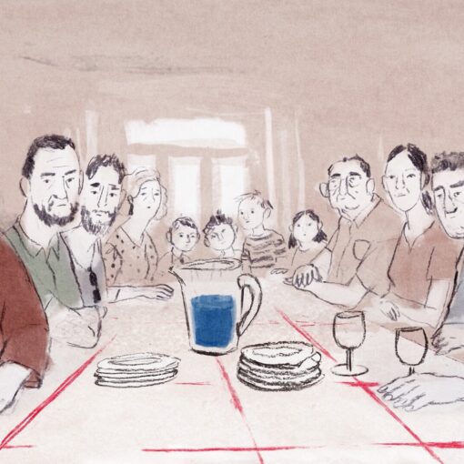 Una mesa repleta de gente dispuesta para comer.